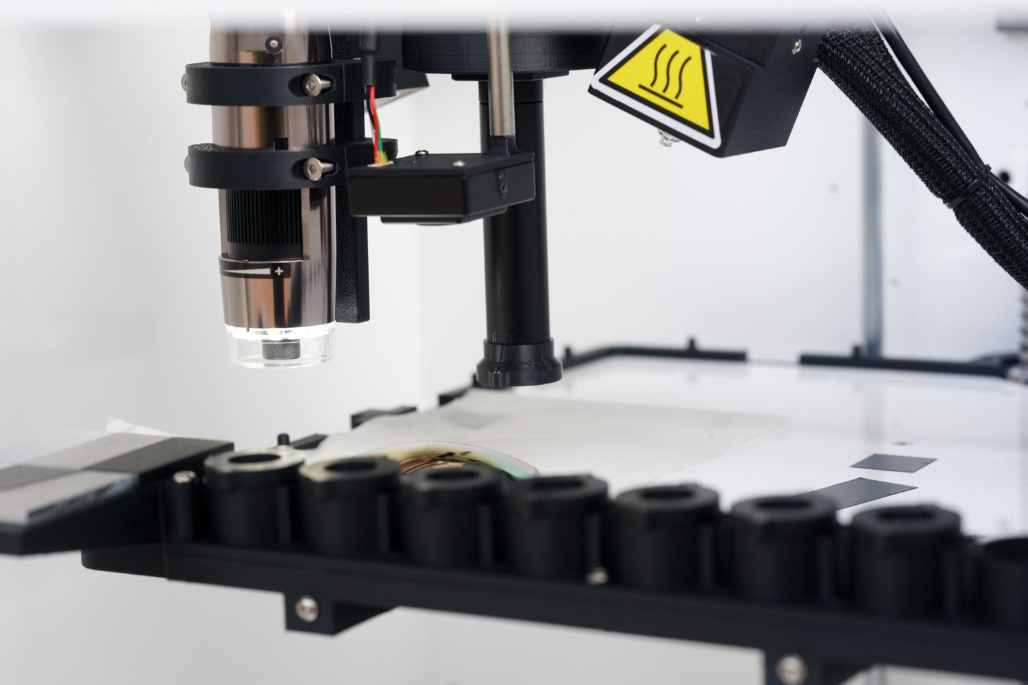 MODI scanner head close up image with imaging accessories in a tray